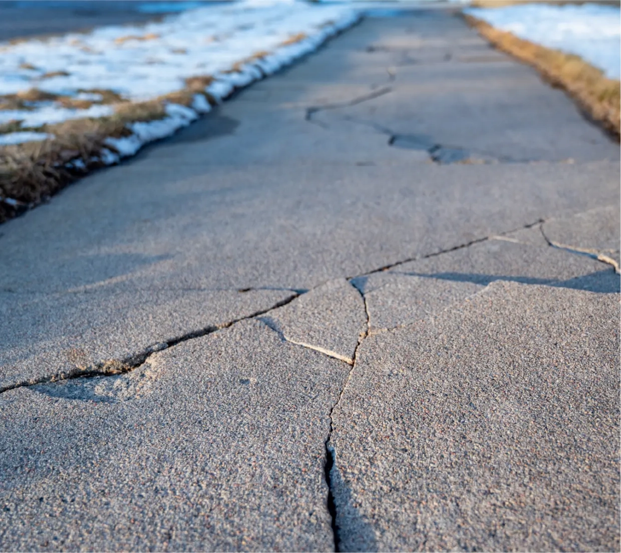 /images/solutions/detail/slider/cracked-sidewalk@2x.webp